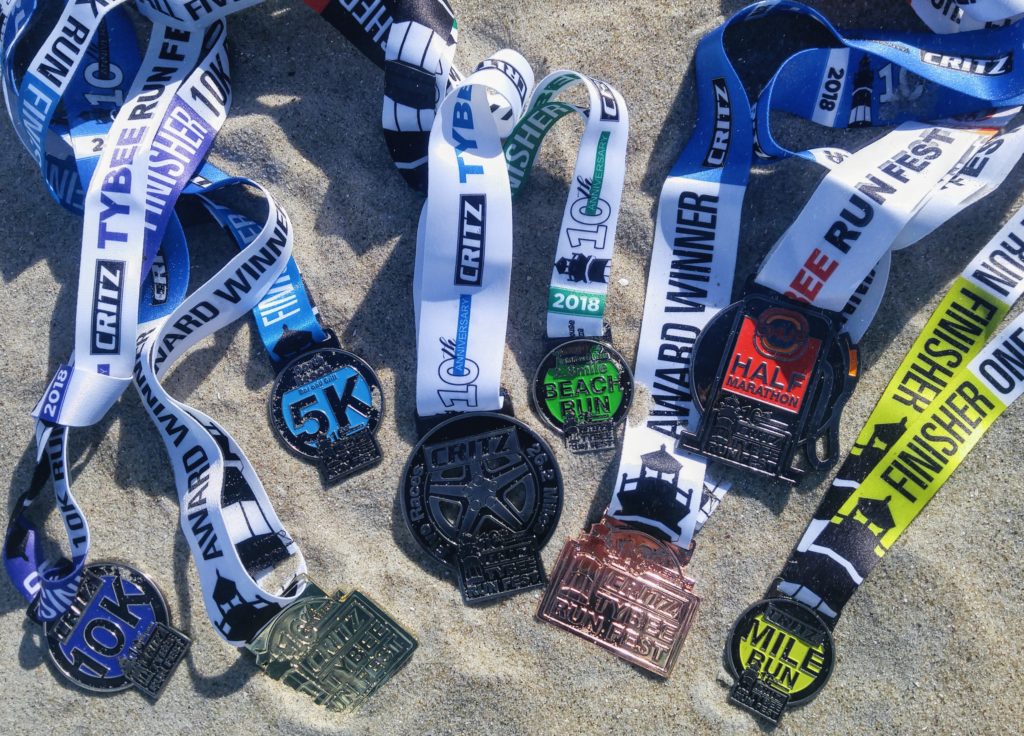 Critz Tybee Run Fest 2018 - Eight medals in the sand, six finisher and two age group medals